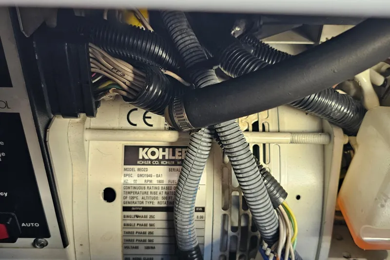 Slide: The Image of Close-up of Kohler generator wiring inside a 2005 Regal Commodore 4260 boat. - 41