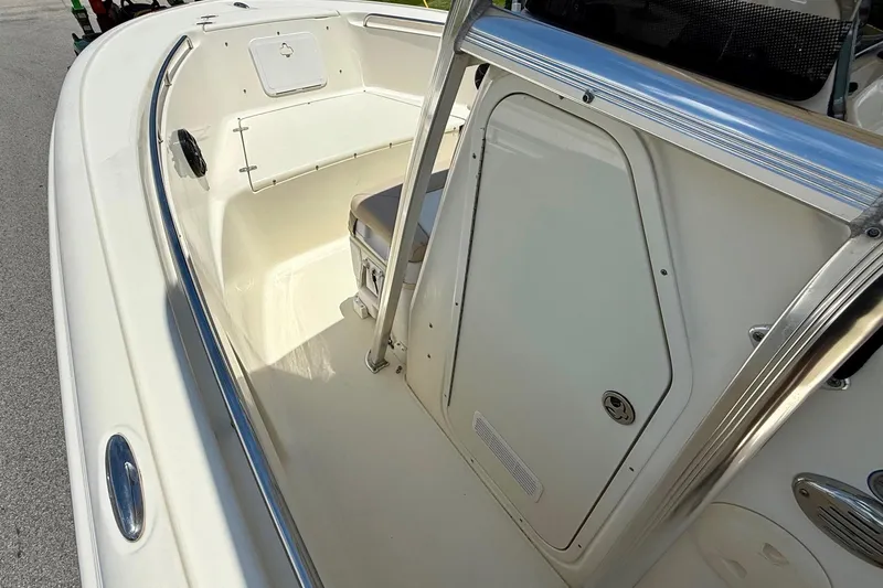 Slide: The Image of 2008 Scout 222 Sportfish boat interior with seating and storage area. - 12