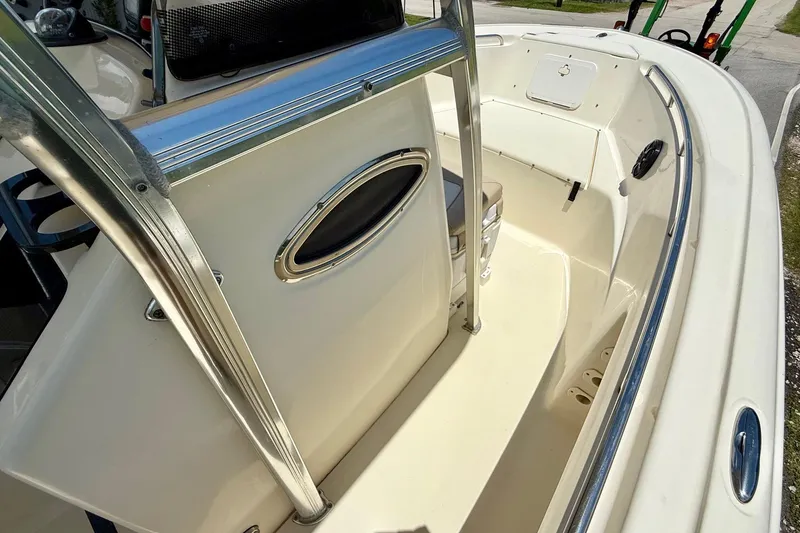 Slide: The Image of 2008 Scout 222 Sportfish boat interior with seating and stainless steel railings. - 15