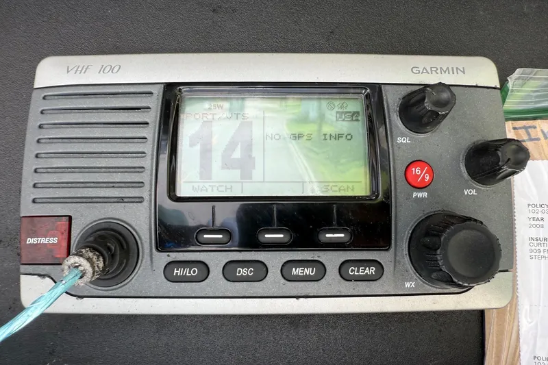 Slide: The Image of Garmin VHF 100 marine radio on 2008 Scout 222 Sportfish boat dashboard. - 20