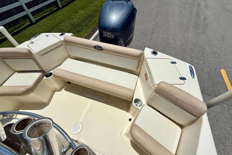 Slide: The Image of 2008 Scout 222 Sportfish boat interior with seating and Yamaha 250 outboard motor. - 7