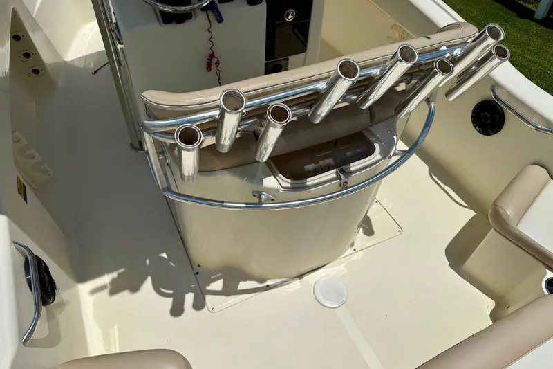 Slide: The Image of 2008 Scout 222 Sportfish boat interior with rod holders and seating. - 8