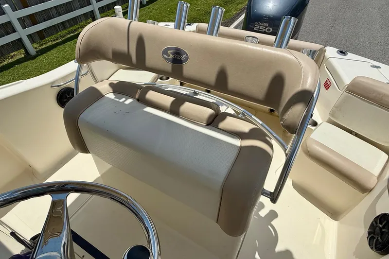 Slide: The Image of 2008 Scout 222 Sportfish boat interior with beige seating and Yamaha 250 engine. - 9