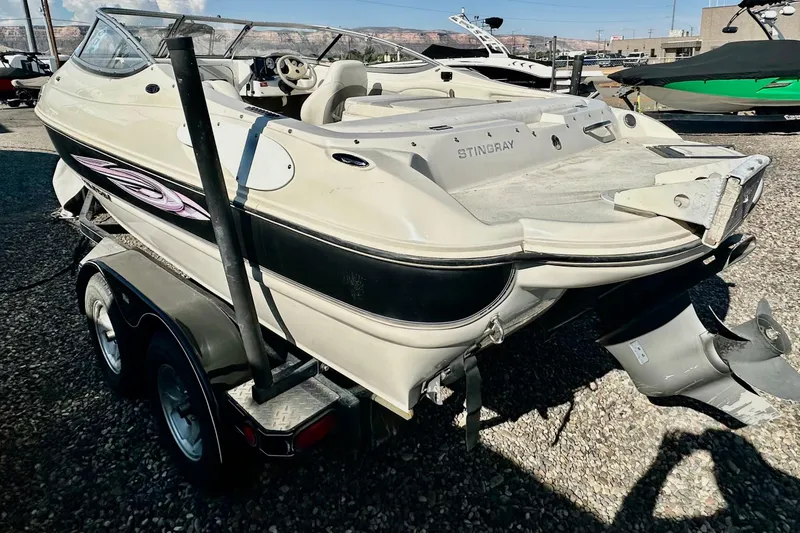 Slide: The Image of 2010 Stingray 205 CS/CX boat on trailer, parked outdoors, rear view. - 6