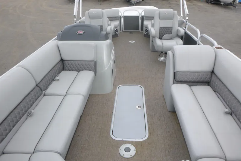 Slide: The Image of 2024 Ranger Reata 243C pontoon boat interior with spacious seating and modern design. - 4