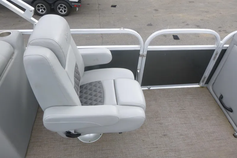 Slide: The Image of 2024 Ranger Reata 243C boat seat with gray upholstery and diamond pattern design. - 8