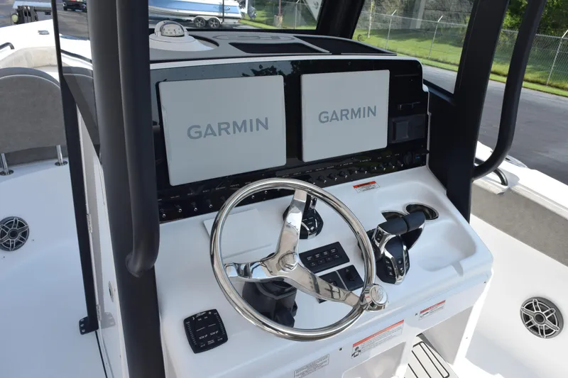 Slide: The Image of 2026 Sea Hunt Ultra 275 SE boat dashboard with Garmin navigation system. - 10