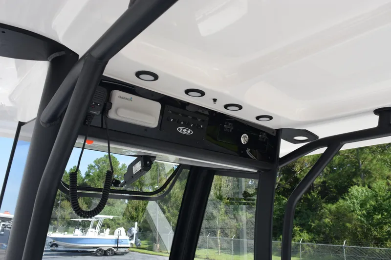 Slide: The Image of 2026 Sea Hunt Ultra 275 SE boat console with Garmin electronics and sturdy frame. - 11