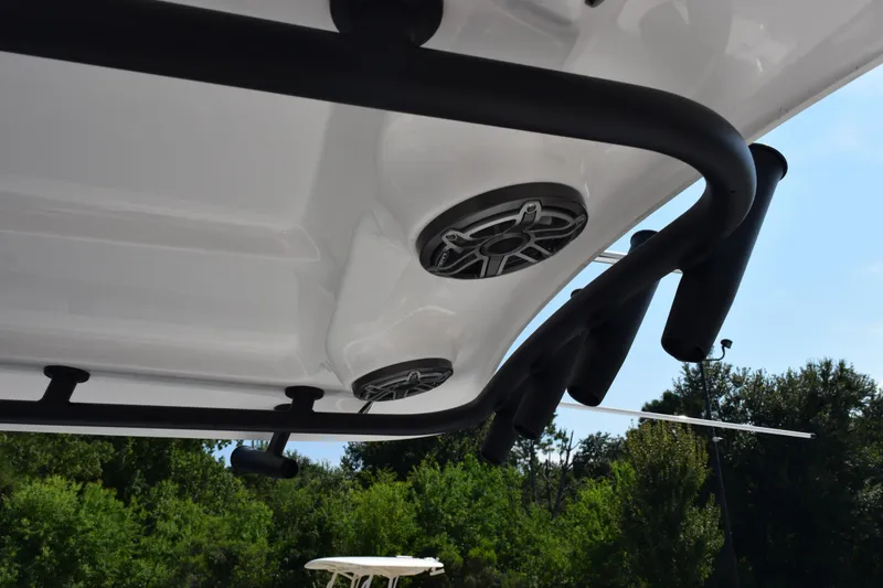 Slide: The Image of 2026 Sea Hunt Ultra 275 SE boat roof with speakers and rod holders. - 12