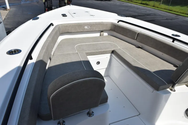 Slide: The Image of 2026 Sea Hunt Ultra 275 SE boat interior with gray cushioned seating. - 14