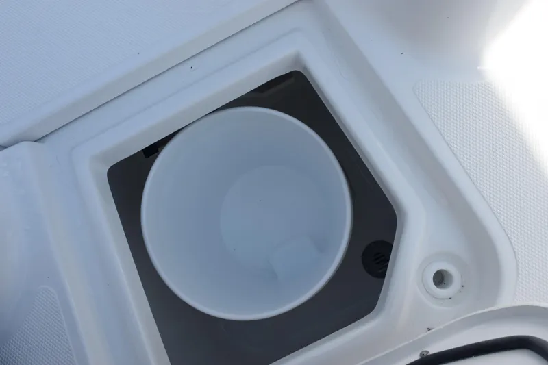 Slide: The Image of 2026 Sea Hunt Ultra 275 SE boat compartment with built-in cup holder. - 17