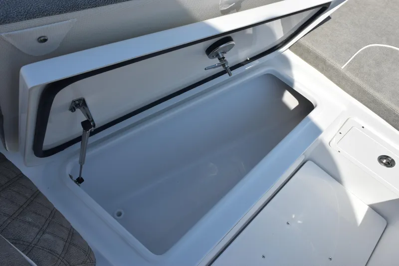 Slide: The Image of Open storage compartment on 2026 Sea Hunt Ultra 275 SE boat. - 18