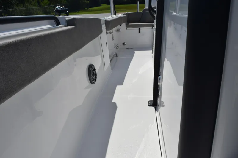 Slide: The Image of 2026 Sea Hunt Ultra 275 SE boat interior with sleek white deck and seating. - 20