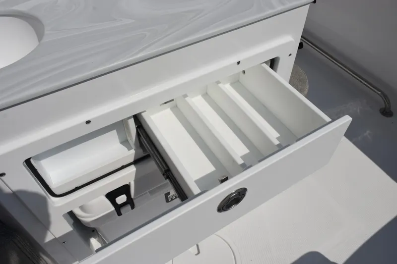 Slide: The Image of Open storage drawer on 2026 Sea Hunt Ultra 275 SE boat. - 27