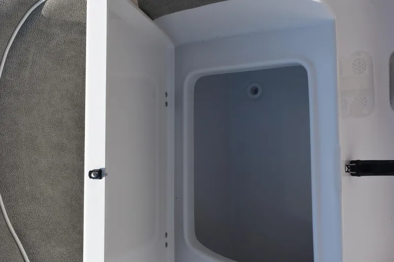 Slide: The Image of Open storage compartment on 2026 Sea Hunt Ultra 275 SE boat. - 30