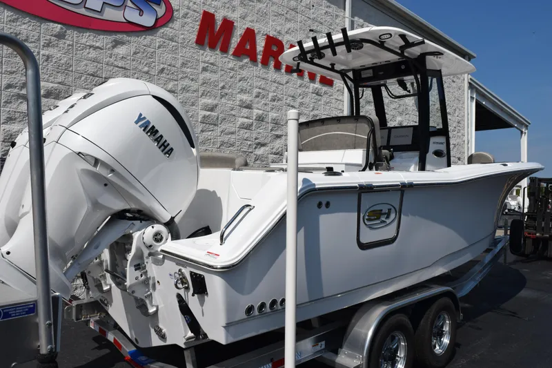 Slide: The Image of 2026 Sea Hunt Ultra 275 SE boat with Yamaha engine on trailer at marina. - 4