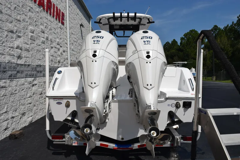 Slide: The Image of 2026 Sea Hunt Ultra 275 SE with twin 250 V6 outboard engines, rear view. - 5