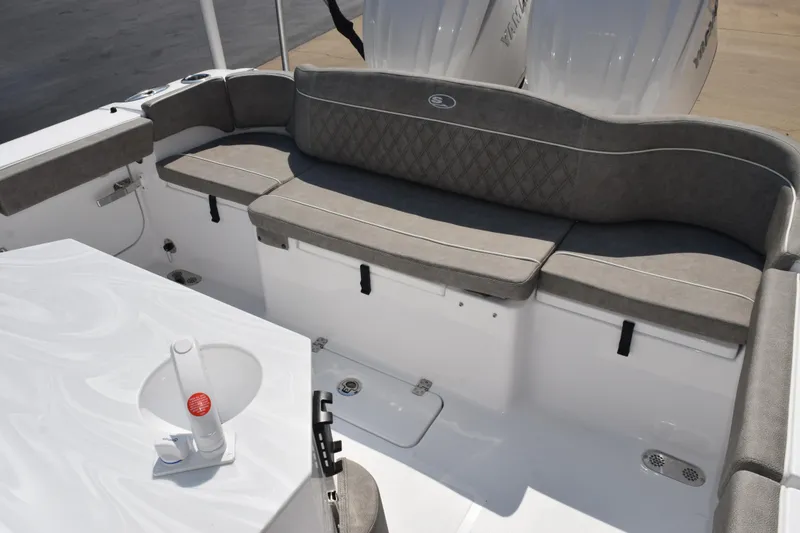 Slide: The Image of 2026 Sea Hunt Ultra 275 SE boat interior with cushioned seating and sleek design. - 8
