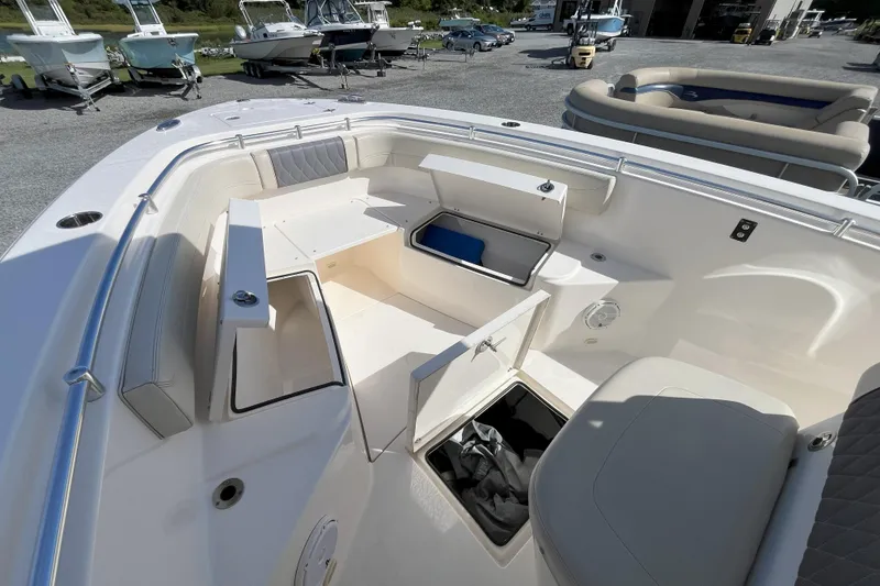 Slide: The Image of 2019 Cobia 277 Center Console boat interior with open storage compartments. - 12