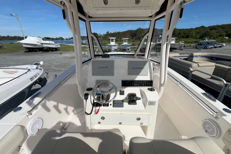 Slide: The Image of 2019 Cobia 277 Center Console boat interior with Garmin navigation system. - 3