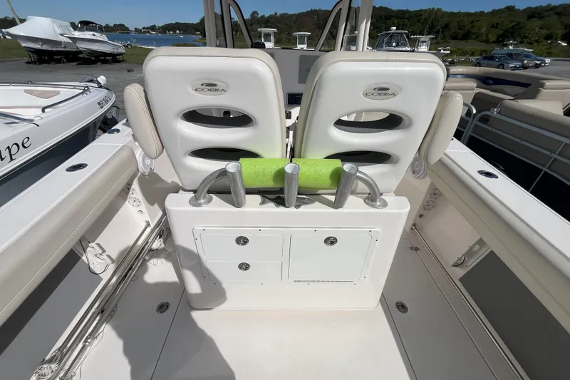 Slide: The Image of 2019 Cobia 277 Center Console boat interior with seating and storage compartments. - 5