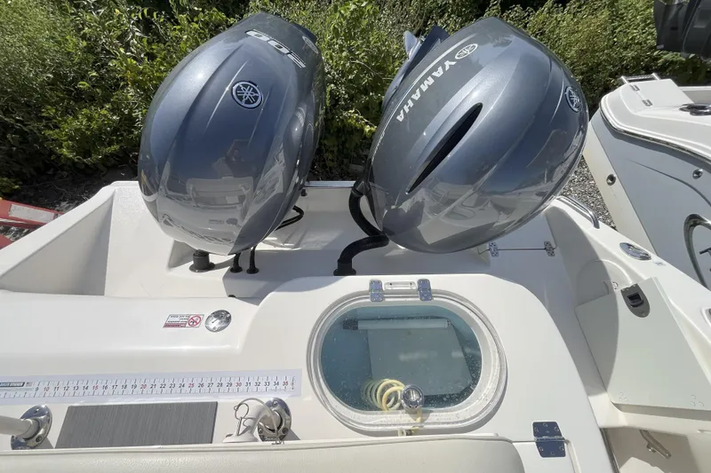 Slide: The Image of 2019 Cobia 277 Center Console with dual Yamaha outboard engines. - 8
