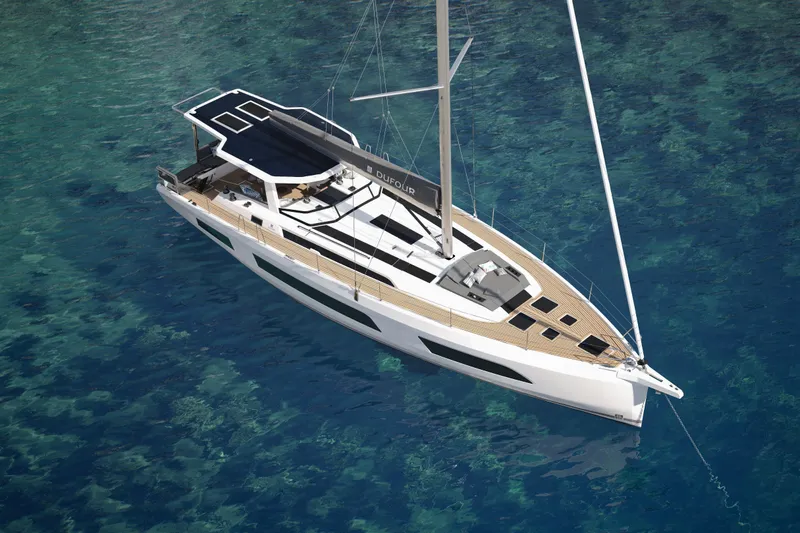 The Image of 2026 Dufour 54 yacht sailing on clear blue water. - 0