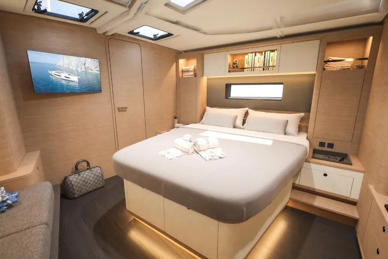 Slide: The Image of Luxurious interior of 2026 Dufour 54 yacht with elegant bedroom and modern amenities. - 20