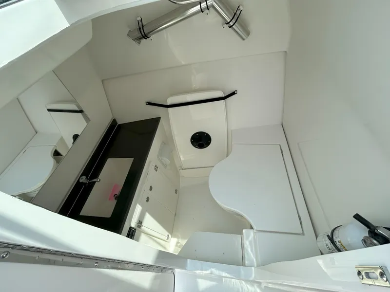 Slide: The Image of 2026 Pursuit DC 326 boat interior with modern bathroom amenities. - 16