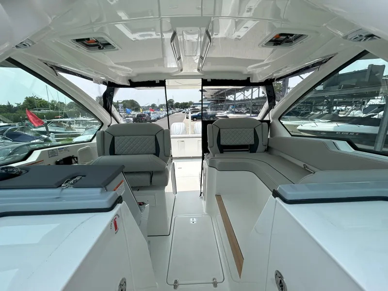 Slide: The Image of 2026 Pursuit DC 326 boat interior with modern seating and sleek design. - 20