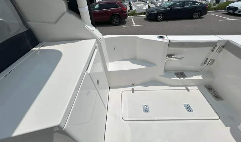 Slide: The Image of 2026 Pursuit DC 326 boat deck with storage compartments and sleek design. - 8