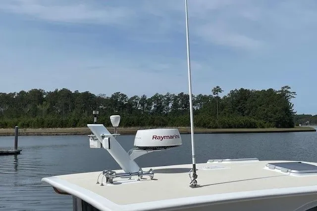 Slide: The Image of 2003 Legacy Yachts 34 Express with Raymarine equipment on calm water. - 28