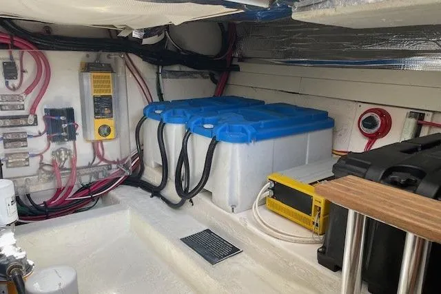 Slide: The Image of Engine room of 2003 Legacy Yachts 34 Express with batteries and wiring. - 29