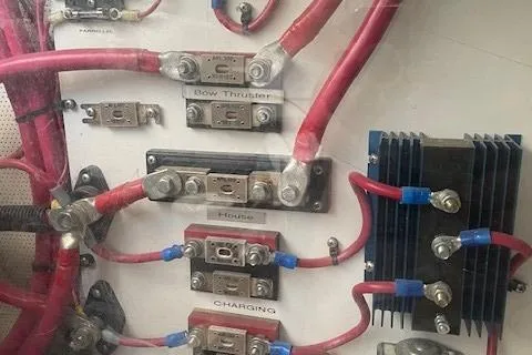 Slide: The Image of Electrical panel of 2003 Legacy Yachts 34 Express with labeled wiring and components. - 32