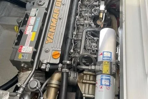 Slide: The Image of Engine of 2003 Legacy Yachts 34 Express, featuring Yanmar diesel components. - 34