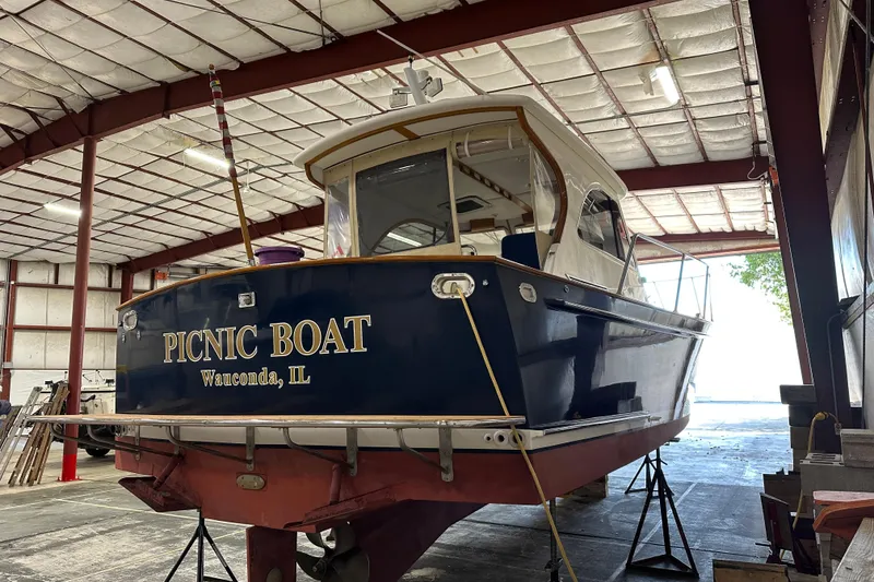 Slide: The Image of 2003 Legacy Yachts 34 Express "Picnic Boat" in a warehouse, Wauconda, IL. - 5