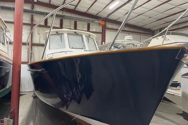 Slide: The Image of 2003 Legacy Yachts 34 Express in storage, showcasing sleek design and craftsmanship. - 9