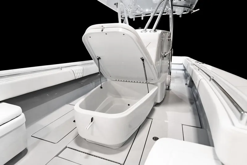 Slide: The Image of 2026 Contender 35 ST boat interior with open storage compartment, sleek white design. - 14