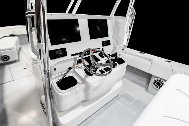Slide: The Image of 2026 Contender 35 ST boat cockpit with modern steering and dual screens. - 9