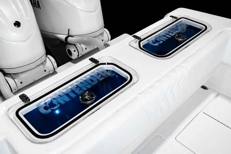 Slide: The Image of 2026 Contender 35 ST boat console with rod holders and storage compartments. - 10