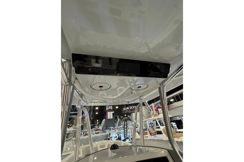 Slide: The Image of 2026 Contender 35 ST boat interior with control panel at a boat show. - 15