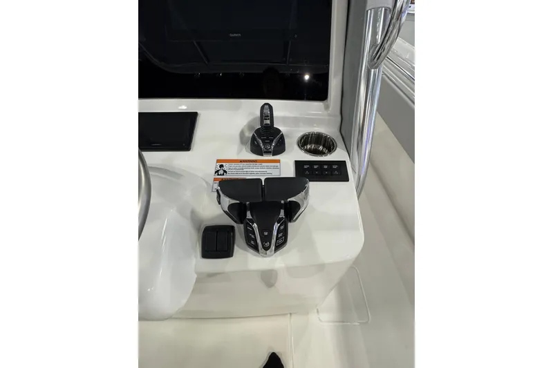 Slide: The Image of Control panel of 2026 Contender 35 ST boat with throttle and cup holder. - 16