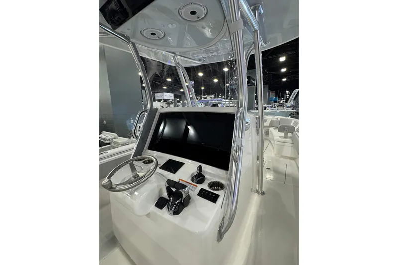 Slide: The Image of 2026 Contender 35 ST boat helm with modern controls and sleek design. - 19