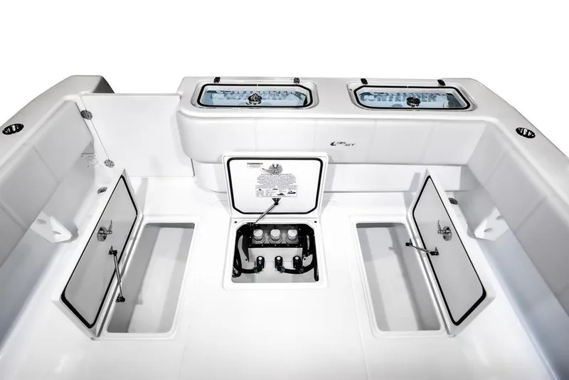 Slide: The Image of 2026 Contender 35 ST boat with open storage compartment and cup holders. - 7