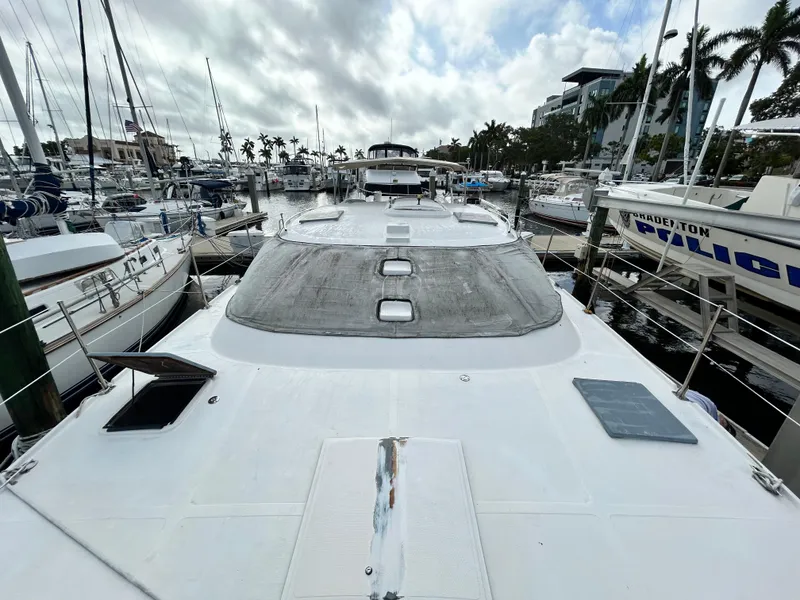 Slide: The Image of 2004 Endeavour Catamaran Victory docked at a marina. - 11