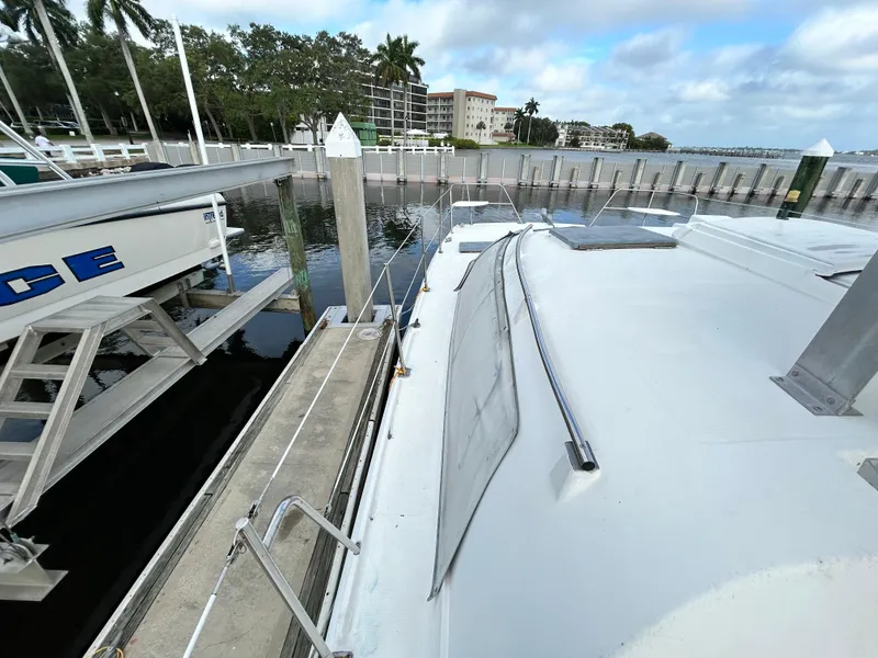 Slide: The Image of 2004 Endeavour Catamaran Victory docked at marina with waterfront view. - 14