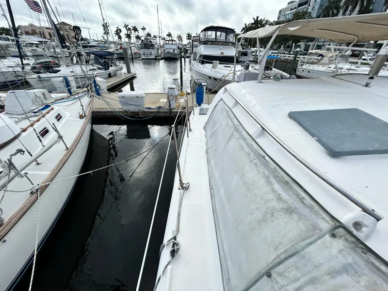 Slide: The Image of 2004 Endeavour Catamaran Victory docked at a marina with other boats. - 16