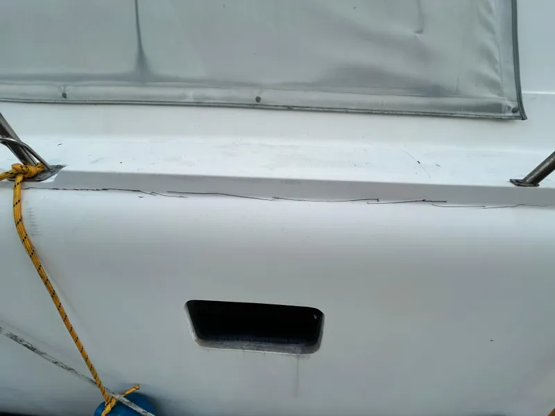 Slide: The Image of Close-up of 2004 Endeavour Catamaran Victory showing deck and hull with visible wear. - 21