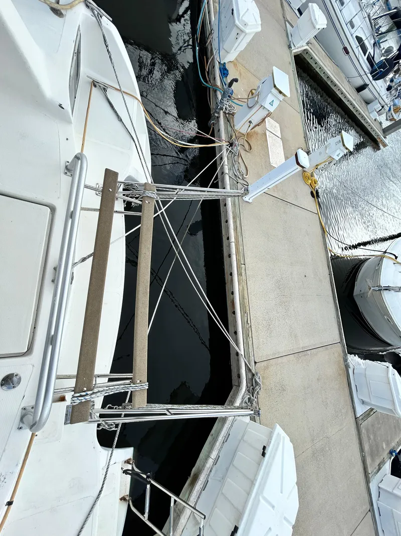 Slide: The Image of 2004 Endeavour Catamaran Victory docked at marina. - 27