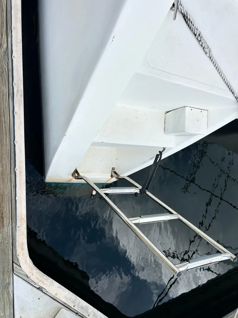 Slide: The Image of 2004 Endeavour Catamaran Victory with a boarding ladder at the dock. - 31